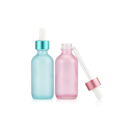 半透明で青いピンクのガラス点滴器の空の精油のびん30ml