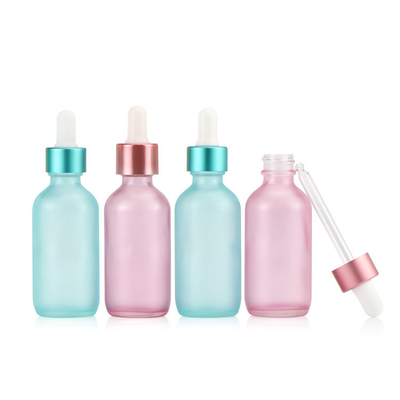 半透明で青いピンクのガラス点滴器の空の精油のびん30ml